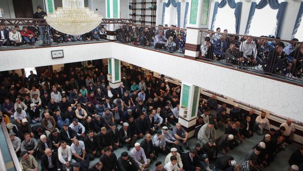 Muslims celebrating Eid al-Adha at a mosque in Ust-Dzheguta in the Russian Caucasus. - Sputnik International