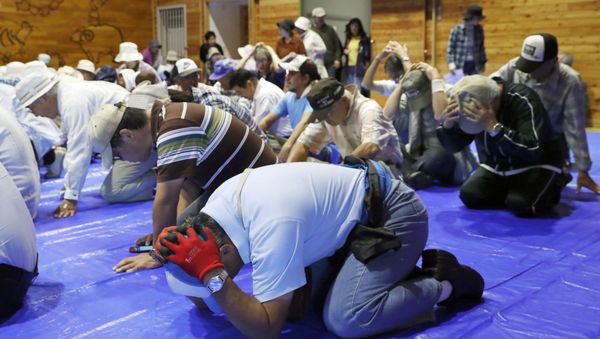 Local residents take part in an emergency drill in the wake of repeated missile launches by North Korea, in Takikawa on Japan's northernmost main island of Hokkaido, in this photo taken by Kyodo September 1, 2017 - Sputnik International
