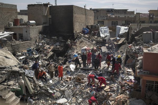 In this Friday, March 24, 2017 photo, civil protection rescue teams work on the debris of a destroyed house to recover bodies of people killed during fighting between Iraqi security forces and Daesh militants on the western side of Mosul, Iraq In this Friday, March 24, 2017 photo, civil protection rescue teams work on the debris of a destroyed house to recover bodies of people killed during fighting between Iraqi security forces and Daesh militants on the western side of Mosul, Iraq - Sputnik International