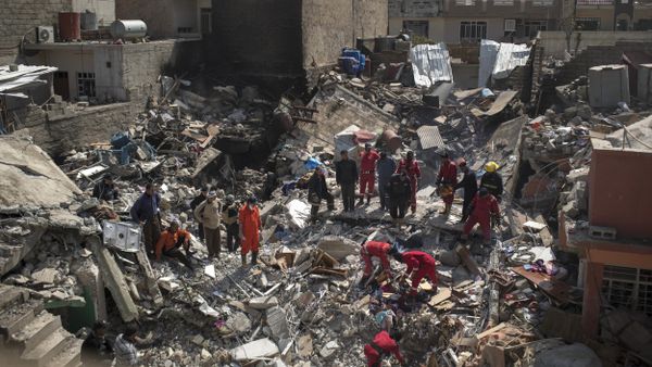 In this Friday, March 24, 2017 photo, civil protection rescue teams work on the debris of a destroyed house to recover the body of people killed during fighting between Iraqi security forces and Islamic State militants on the western side of Mosul, Iraq - Sputnik International
