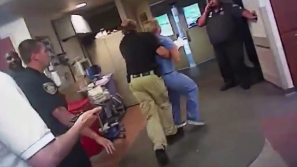 Utah nurse is arrested and handcuffed for refusing to draw unconscious patient's blood - Sputnik International