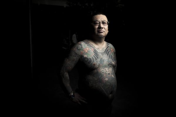 In this picture taken on May 20, 2017, a man poses for photographs showing his Irezumi Japanese traditional tattoos related to the Yakuza's universe, during the Sanja Matsuri festival in Tokyo - Sputnik International