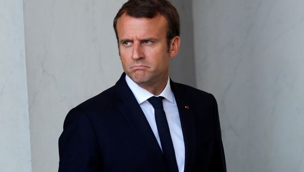 French President Emmanuel Macron walks back to his office after a meeting with guests at the Elysee Palace in Paris, France, August 31, 2017 - Sputnik International