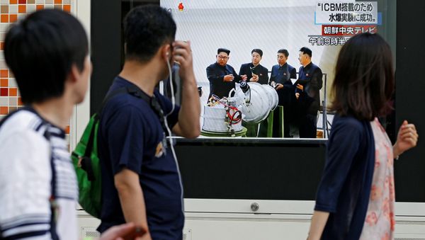 People walk past a street monitor showing North Korea's leader Kim Jong-Un in a news report about North Korea's nuclear test, in Tokyo, Japan, September 3, 2017 People walk past a street monitor showing North Korea's leader Kim Jong-Un in a news report about North Korea's nuclear test, in Tokyo, Japan, September 3, 2017 - Sputnik International