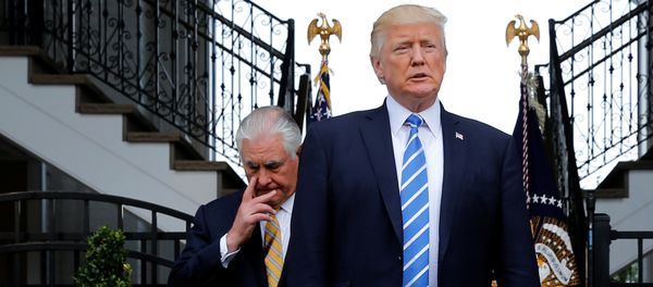 U.S. President Donald Trump (R), trailed by Secretary of State Rex Tillerson, arrives to speak to reporters after their meeting at Trump's golf estate in Bedminster, New Jersey U.S. August 11, 2017 U.S. President Donald Trump (R), trailed by Secretary of State Rex Tillerson, arrives to speak to reporters after their meeting at Trump's golf estate in Bedminster, New Jersey U.S. August 11, 2017 - Sputnik International