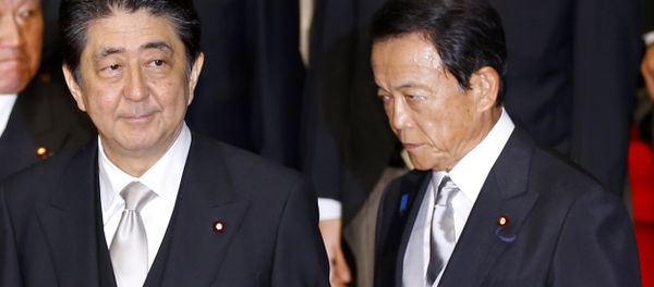 In this Aug. 3, 2017 photo, Japan's Prime Minister Shinzo Abe, left, and Deputy Prime Minister Taro Aso leave after an official photo session with Abe's new Cabinet at the prime minister's official residence in Tokyo In this Aug. 3, 2017 photo, Japan's Prime Minister Shinzo Abe, left, and Deputy Prime Minister Taro Aso leave after an official photo session with Abe's new Cabinet at the prime minister's official residence in Tokyo - Sputnik International