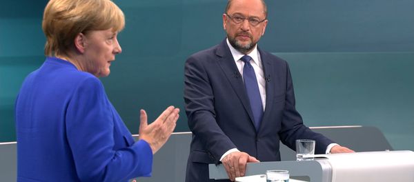 A screen that shows the TV debate between German Chancellor Angela Merkel of the Christian Democratic Union (CDU) and her challenger Germany's Social Democratic Party SPD candidate for chancellor Martin Schulz in Berlin, Germany, September 3, 2017. - Sputnik International