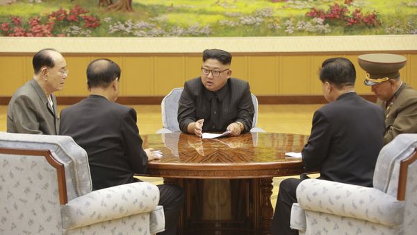 In this Sept. 3, 2017, image distributed on Monday, Sept. 4, 2017, by the North Korean government, North Korea's leader Kim Jong Un holds a meeting of the ruling party's presidium - Sputnik International
