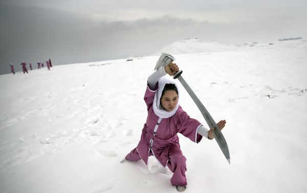 A Shaolin martial arts student practices on a hilltop in Kabul, Afghanistan A Shaolin martial arts student practices on a hilltop in Kabul, Afghanistan - Sputnik International