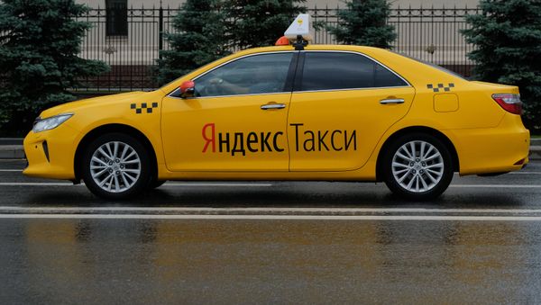 A car of the Yandex Taxi service in a street of Moscow A car of the Yandex Taxi service in a street of Moscow - Sputnik International