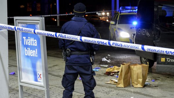 A police officer stands inside a roped off an area on a gas station in Fittja, Sweden, where a man was found severely injured in a minivan after being shot at when taking part in a pro-Kurdish demonstration Saturday, Feb. 13, 2016 A police officer stands inside a roped off an area on a gas station in Fittja, Sweden, where a man was found severely injured in a minivan after being shot at when taking part in a pro-Kurdish demonstration Saturday, Feb. 13, 2016 - Sputnik International