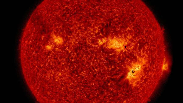 This NASA image of the enormous solar storms that occurred on September 6 shows both sunspots visible on the Sun's surface and the flare in the solar atmosphere. This NASA image of the enormous solar storms that occurred on September 6 shows both sunspots visible on the Sun's surface and the flare in the solar atmosphere. - Sputnik International