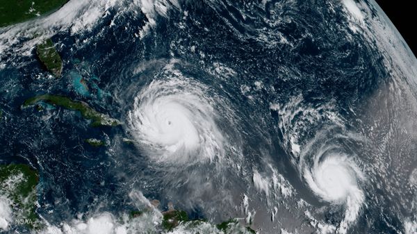 In this GOES-16 geocolor image satellite image taken Thursday, Sept. 7, 2017, the eye of Hurricane Irma, left, is just north of the island of Hispaniola, with Hurricane Jose, right, in the Atlantic Ocean - Sputnik International