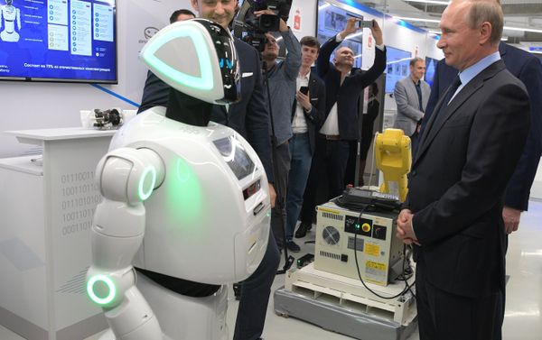 Russian President Vladimir Putin views a showroom of small and medium-size businesses engaged in 'digital economy' as he visits the ER-Telecom Holding in Perm Russian President Vladimir Putin views a showroom of small and medium-size businesses engaged in 'digital economy' as he visits the ER-Telecom Holding in Perm - Sputnik International