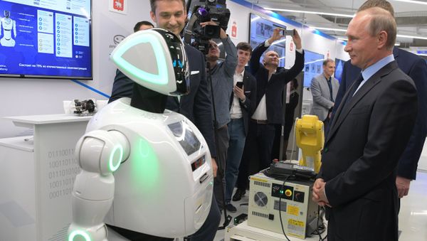 Russian President Vladimir Putin views a showroom of small and medium-size businesses engaged in 'digital economy' as he visits the ER-Telecom Holding in Perm - Sputnik International