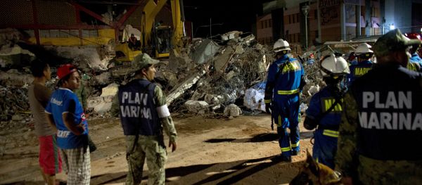 Rescuers sift through the rubble of the partially collapsed city hall in Juchitan , Oaxaca state, Mexico, following a massive earthquake, Friday, Sept. 8, 2017 Rescuers sift through the rubble of the partially collapsed city hall in Juchitan , Oaxaca state, Mexico, following a massive earthquake, Friday, Sept. 8, 2017 - Sputnik International