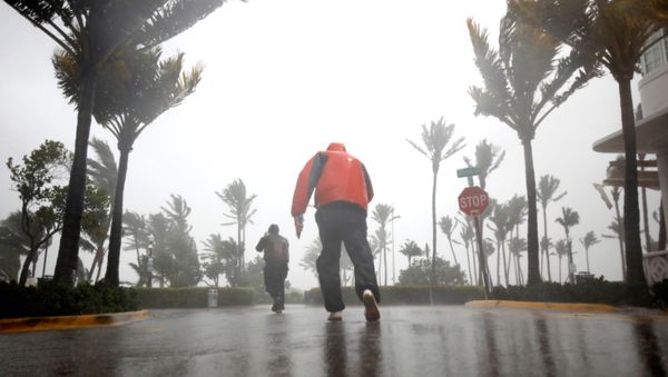 People walk along a street in South Beach as Hurricane Irma arrives at south Florida, in Miami Beach, Florida, U.S., September 10, 2017 - Sputnik International