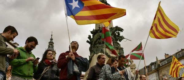 Pro independence supporters wave estelada or pro independence flags during a rally in support for the secession of the Catalonia region from Spain, in Vitoria, northern Spain, Saturday, Sept. 9, 2017 - Sputnik International