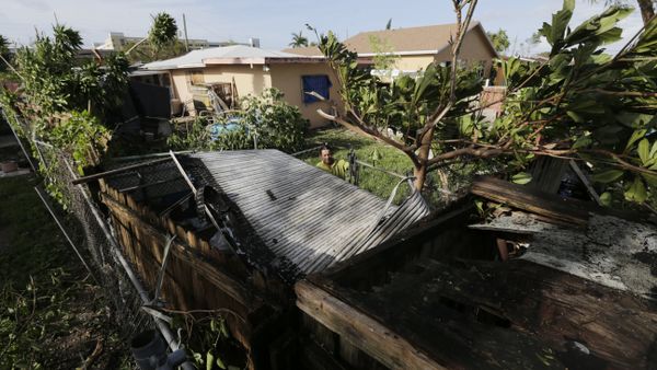 Bayardo Perez prepares to dismantle the mangled tin roof of his shed in Sweetwater, Fla., Monday, Sept. 11. - Sputnik International