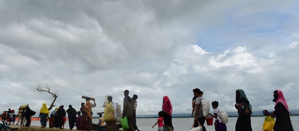 Rohingya Muslim refugees arrive from Myanmar after crossing the Naf river in the Bangladeshi town of Teknaf Rohingya Muslim refugees arrive from Myanmar after crossing the Naf river in the Bangladeshi town of Teknaf - Sputnik International