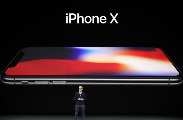 Apple CEO Tim Cook announces the new iPhone X at the Steve Jobs Theater on the new Apple campus, Tuesday, Sept. 12, 2017, in Cupertino, California. - Sputnik International