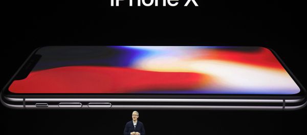 Apple CEO Tim Cook announces the new iPhone X at the Steve Jobs Theater on the new Apple campus, Tuesday, Sept. 12, 2017, in Cupertino, California. - Sputnik International