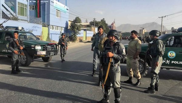 Afghan security police stand guard near the site of a deadly suicide attack outside a cricket stadium, in Kabul, Afghanistan - Sputnik International