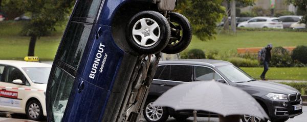 A Volkswagen Touareg stands upside down in front of the fair ground of the IAA Motor Show in Frankfurt, Germany, Wednesday, Sept. 13, 2017. The environmental organization Greenpeace installed the car the day before to protest against the car industry. From frighteningly fast hypercars to new electric SUVs, the Frankfurt auto show is a major event for car lovers wanting to get a glimpse of the future. A Volkswagen Touareg stands upside down in front of the fair ground of the IAA Motor Show in Frankfurt, Germany, Wednesday, Sept. 13, 2017. The environmental organization Greenpeace installed the car the day before to protest against the car industry. From frighteningly fast hypercars to new electric SUVs, the Frankfurt auto show is a major event for car lovers wanting to get a glimpse of the future. - Sputnik International
