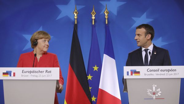 German Chancellor Angela Merkel, left, and French President Emmanuel Macron prepare to address the media at an EU summit in Brussels on Friday, June 23, 2017. German Chancellor Angela Merkel, left, and French President Emmanuel Macron prepare to address the media at an EU summit in Brussels on Friday, June 23, 2017. - Sputnik International