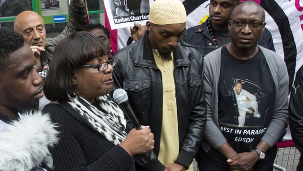 Member of Parliament, Diane Abbott, left, Ginario Da Costa, right, the father of Edson Da Costa, and Esa Charles, father of Rashan Charles who died after contact with police last Saturday, arrives at a protest over his death at Stoke Newington police station, London, Saturday July 29, 2017. - Sputnik International