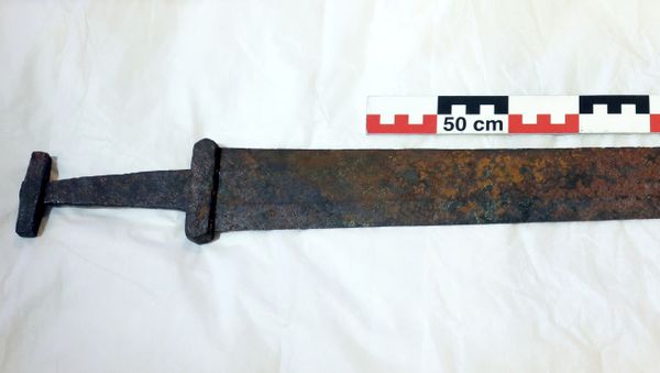 In this photo taken on Sept. 5, 2017, an ancient Viking sword, believed to date from about 850-950 A.D, that was found slid down between rocks on a mountain during a reindeer hunt in southern Norway, is being measured as it is displayed in Lillehammer. Archeologists believe the sword's preservation was likely due to the quality of the iron, as well as the cold, dry conditions. - Sputnik International