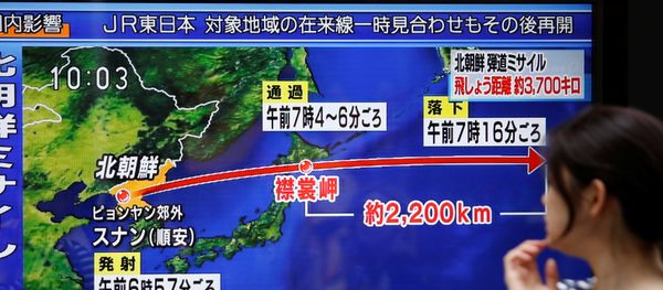 A passerby looks at a TV screen reporting news about North Korea's missile launch in Tokyo, Japan September 15, 2017 - Sputnik International