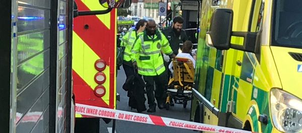 Emergency personnel attend to a person after an incident at Parsons Green underground station in London, Britain, September 15, 2017 Emergency personnel attend to a person after an incident at Parsons Green underground station in London, Britain, September 15, 2017 - Sputnik International