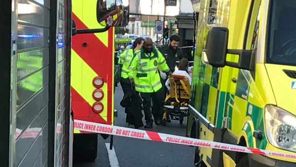 Emergency personnel attend to a person after an incident at Parsons Green underground station in London, Britain, September 15, 2017 - Sputnik International