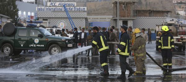 Afghan firefighters work at the site of a suicide attack outside a cricket stadium, in Kabul, Afghanistan Afghan firefighters work at the site of a suicide attack outside a cricket stadium, in Kabul, Afghanistan - Sputnik International