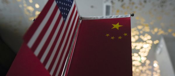 Chinese flags and American flags are displayed in a company in Beijing on August 16, 2017 - Sputnik International