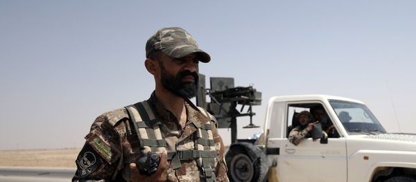 A fighter of Syrian Democratic Forces (SDF) is seen in the eastern Deir al Zor, Syria September 12, 2017 A fighter of Syrian Democratic Forces (SDF) is seen in the eastern Deir al Zor, Syria September 12, 2017 - Sputnik International