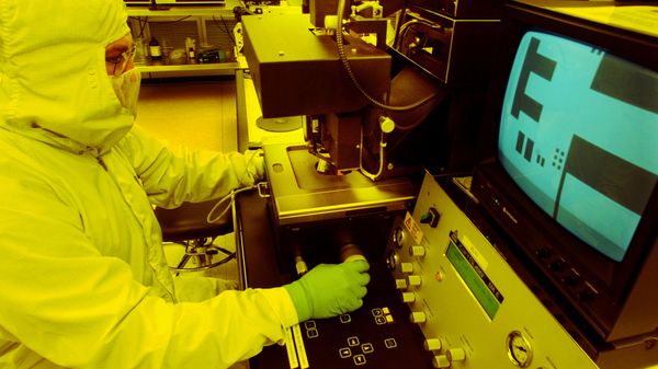 A microchip is projected on a screen by a microscope in a photo lithography room where film emulsion is applied to a microchip wafer A microchip is projected on a screen by a microscope in a photo lithography room where film emulsion is applied to a microchip wafer - Sputnik International