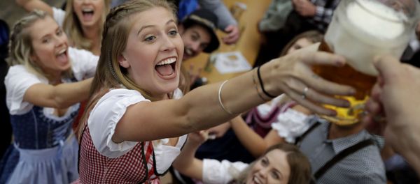 A young woman struggles for beer during the opening of the 184th Oktoberfest beer festival in Munich, Germany, Saturday, Sept. 16, 2017. The world's largest beer festival will be held from Sept. 16 until Oct. 3. A young woman struggles for beer during the opening of the 184th Oktoberfest beer festival in Munich, Germany, Saturday, Sept. 16, 2017. The world's largest beer festival will be held from Sept. 16 until Oct. 3. - Sputnik International