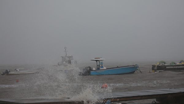 Boats remain anchored in a wharf as Hurricane Maria approaches Guadeloupe island, France, September 18, 2017 - Sputnik International