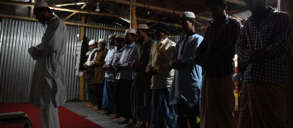 In this photograph taken on September 14, 2017, Rohingya Muslim refugees offer prayers inside a shelter in the Nepali capital Kathmandu In this photograph taken on September 14, 2017, Rohingya Muslim refugees offer prayers inside a shelter in the Nepali capital Kathmandu - Sputnik International