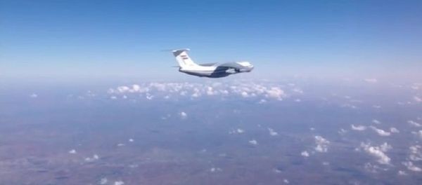 Syrian Air Force aircraft before dropping humanitarian cargo on Russian parachute platforms in the area of Deir ez-Zor, Syria. (A snap shot from the video published by the Russian Defense Ministry at its official YouTube channel. Syrian Air Force aircraft before dropping humanitarian cargo on Russian parachute platforms in the area of Deir ez-Zor, Syria. (A snap shot from the video published by the Russian Defense Ministry at its official YouTube channel. - Sputnik International