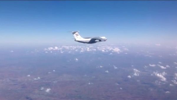 Syrian Air Force aircraft before dropping humanitarian cargo on Russian parachute platforms in the area of Deir ez-Zor, Syria. (A snap shot from the video published by the Russian Defense Ministry at its official YouTube channel. Syrian Air Force aircraft before dropping humanitarian cargo on Russian parachute platforms in the area of Deir ez-Zor, Syria. (A snap shot from the video published by the Russian Defense Ministry at its official YouTube channel. - Sputnik International