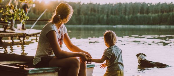 Woman, child, dog and sunset Woman, child, dog and sunset - Sputnik International
