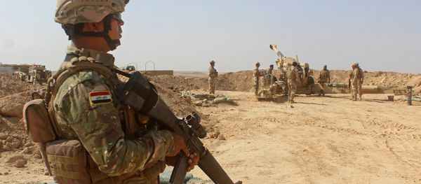 Iraqi forces fire preliminary shells from the area of al-Sakrah, as they prepare a military operation to push out Islamic State (IS) group jihadists from the nearby village of Anah in the northwestern Anbar province Iraqi forces fire preliminary shells from the area of al-Sakrah, as they prepare a military operation to push out Islamic State (IS) group jihadists from the nearby village of Anah in the northwestern Anbar province - Sputnik International