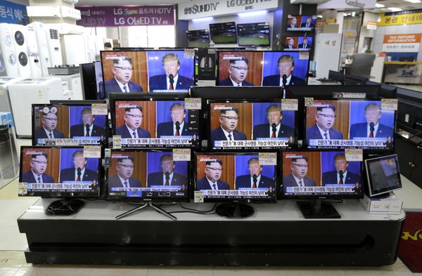 TV screens show a news program with an image of U.S. President Donald Trump and North Korean leader Kim Jong Un TV screens show a news program with an image of U.S. President Donald Trump and North Korean leader Kim Jong Un - Sputnik International