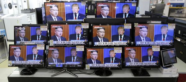 TV screens show a news program with an image of U.S. President Donald Trump and North Korean leader Kim Jong Un TV screens show a news program with an image of U.S. President Donald Trump and North Korean leader Kim Jong Un - Sputnik International