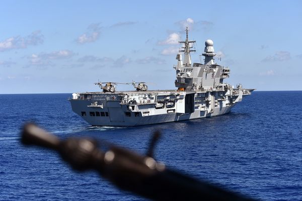 The Italian navy carrier Cavour is seen from German navy frigate ship Werra, as it sails in the Mediterranean Sea, close to the Libyan territorial waters on September 23, 2015 - Sputnik International