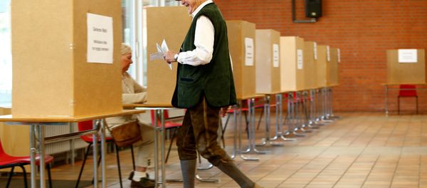 A man in traditional Bavarian costume votes in the general election (Bundestagswahl) in Munich, Germany, September 24, 2017 A man in traditional Bavarian costume votes in the general election (Bundestagswahl) in Munich, Germany, September 24, 2017 - Sputnik International