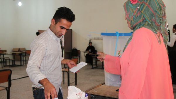 Voting at a polling station in the city of Kirkuk during an independence referendum for Iraqi Kurdistan Voting at a polling station in the city of Kirkuk during an independence referendum for Iraqi Kurdistan - Sputnik International